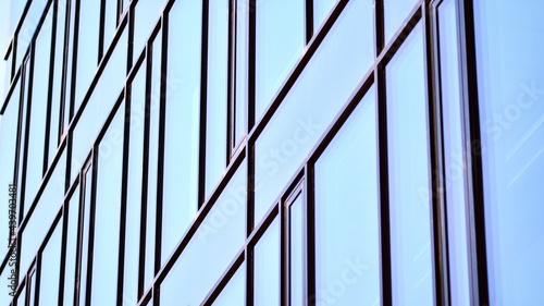 Wallpaper Mural Glass facade of the buildings with a blue sky. Modern building in the business city center. Background of modern glass buildings.  Torontodigital.ca
