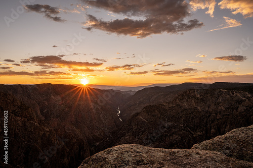 Burst Of Light On The Horizon At Sunet View In Black Canyon photo