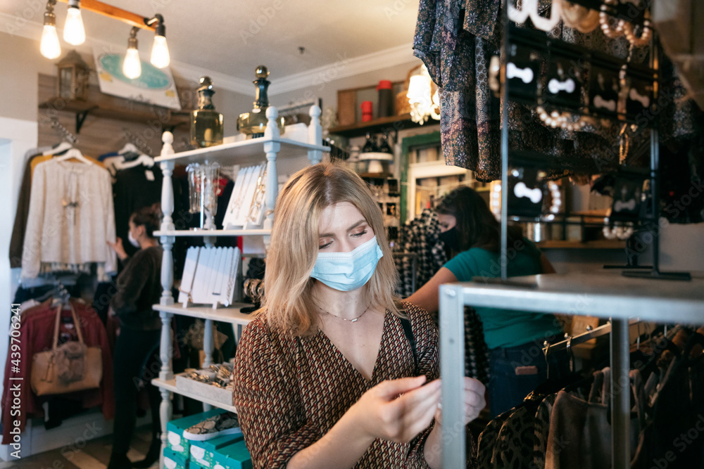 Boutique: Woman Shops For Jewelry In Small Business Boutique: Woman Shops For Jewelry In Small Business