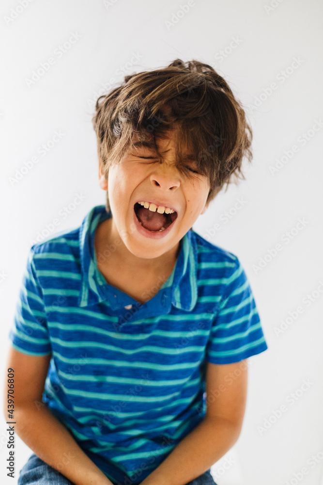 Fun portrait of a boy with closed eyes and open mouth Fun portrait of a boy with closed eyes and open mouth