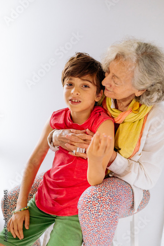 Portrait of colorful grandmother and grandson photo