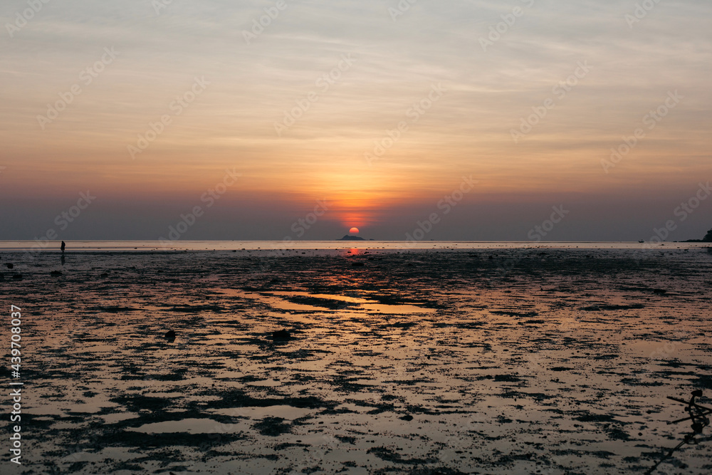Seashore sunset landscape with low tie water Seashore sunset landscape with low tie water