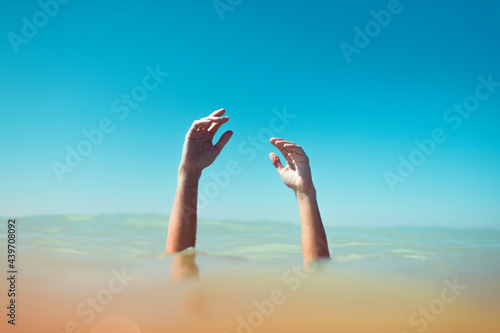 Hands coming out from the water