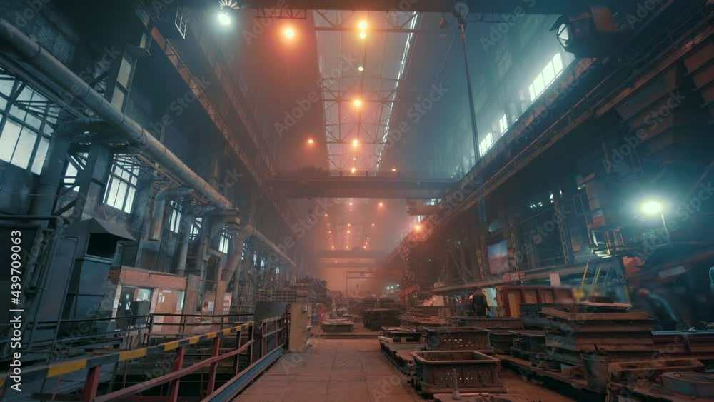 Factory interior. Heavy metallurgy industry. Foundry workshop. Steel Mill industrial plant. Metal manufacture. Large industrial building inside with metalwork equipment. Factory interior. Heavy metallurgy industry. Foundry workshop. Steel Mill industrial plant. Metal manufacture. Large industrial building inside with metalwork equipment.