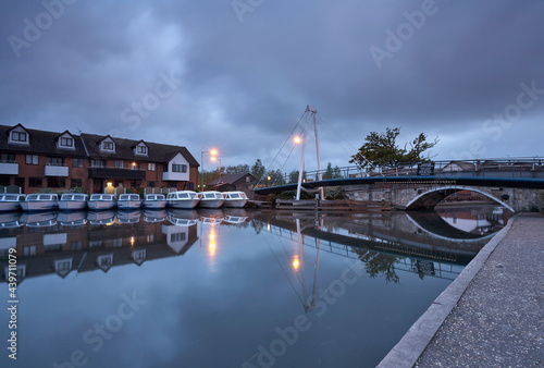 Day boats at dawn. Wroxham, Hoveton, Norfolk Broads, UK. photo