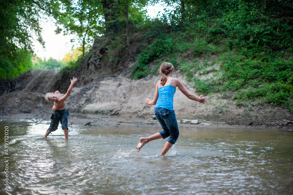 Kids Playing in a River Kids Playing in a River