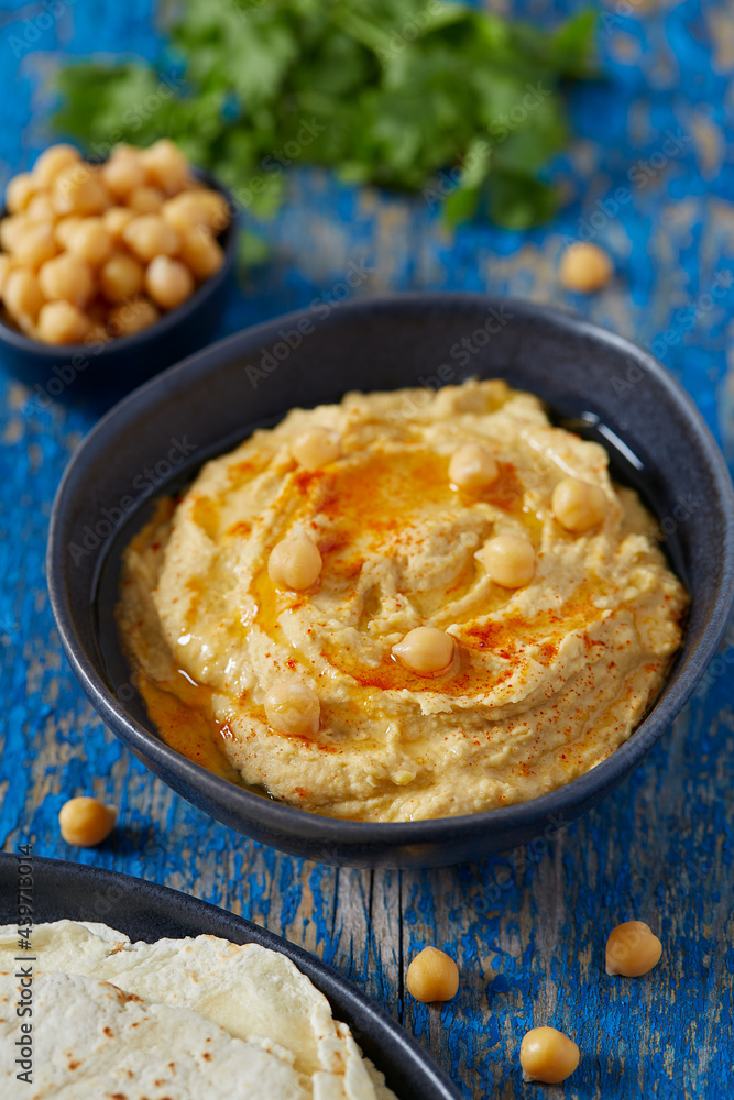 hummus on a wooden surface hummus on a wooden surface
