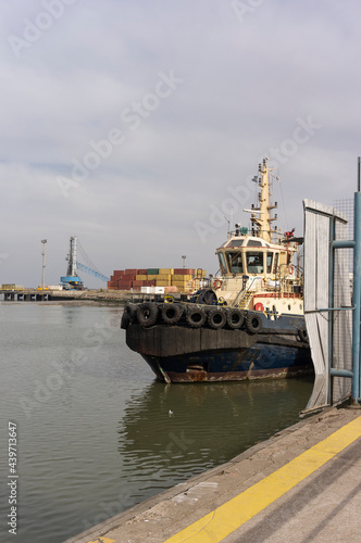 fishing boat moored to the pier in a harbor. © Gabriel