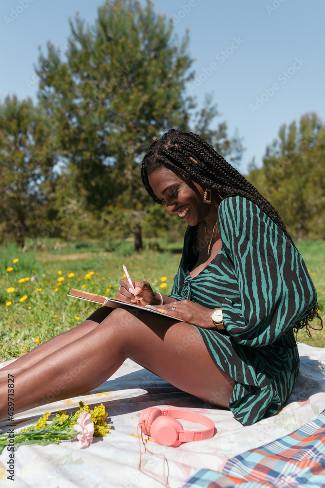 © Lucas Ottone/Stocksy - Black woman at the park