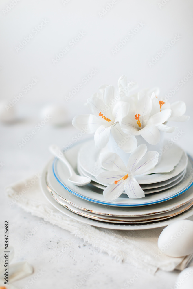 Porcelain, flowers and eggs on table Porcelain, flowers and eggs on table