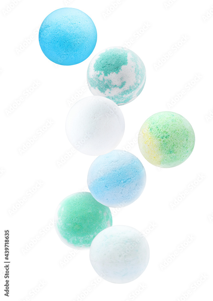 Many different aromatic bath bombs falling on white background Many different aromatic bath bombs falling on white background