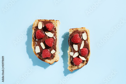 Sliced Hazelnut Spread Toast with Raspberries and Almonds  photo