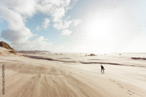 Female silhouette walking at the desert