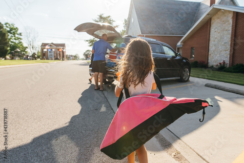 Family loading up the car after a game.  photo