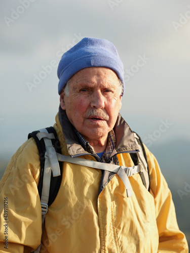 Senior hiker fully outdoors equiped photo