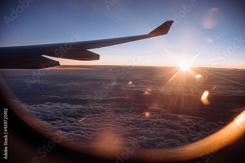 view at the sunrise from the flying aircraft photo
