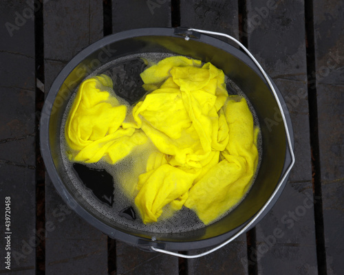bucket of water with cleaning cloth photo