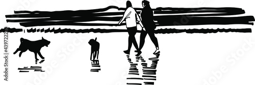 silhouette of a people with dogs on the beach