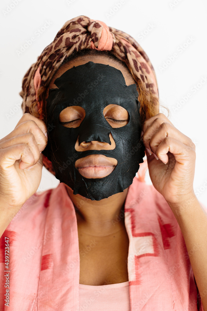Woman applying beauty face mask Woman applying beauty face mask