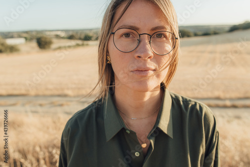 Portrait of a woman looking straight to the camera