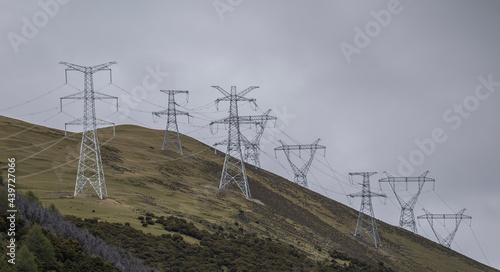 Green energy sources transmission tower on the mountain photo
