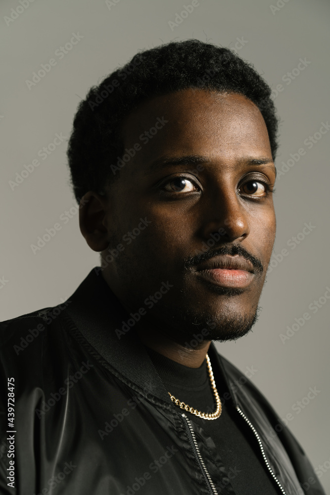 Serious black man in stylish wear in studio Serious black man in stylish wear in studio