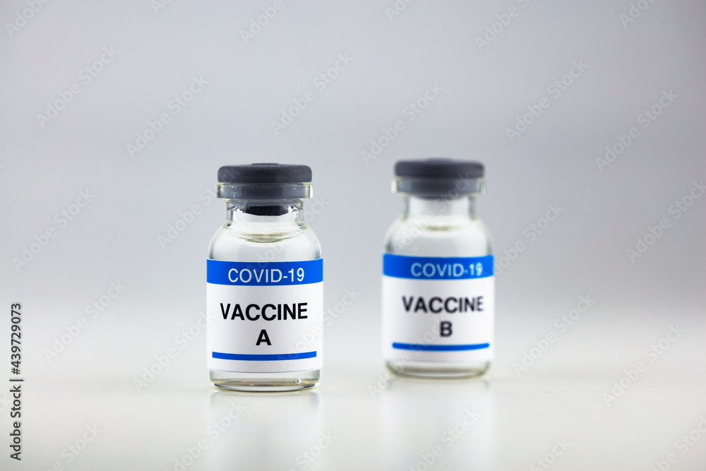 Coronavirus, covid-19 vaccine vials, isolated on neutral white. Effects of different or various kinds on corona virus vaccines.