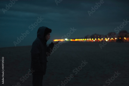Teenage blowing traffic lights