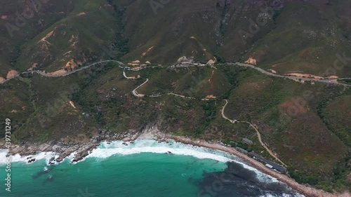Aerial view. Chapmans Peak Drive near Cape Town, South Africa. Top view of road going through beautiful landscape. Road bending along the ocean.