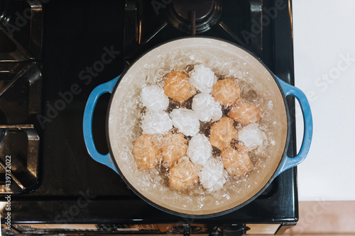 Boiling Water Cooks Eggs on Stove photo