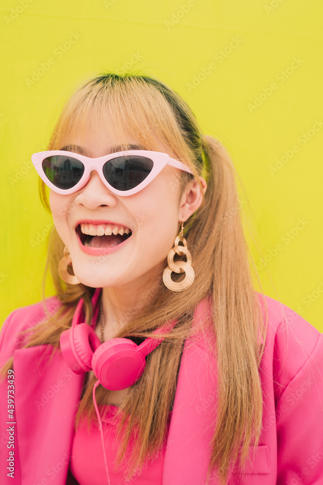 Asian fashion woman with sunglasses and earphones