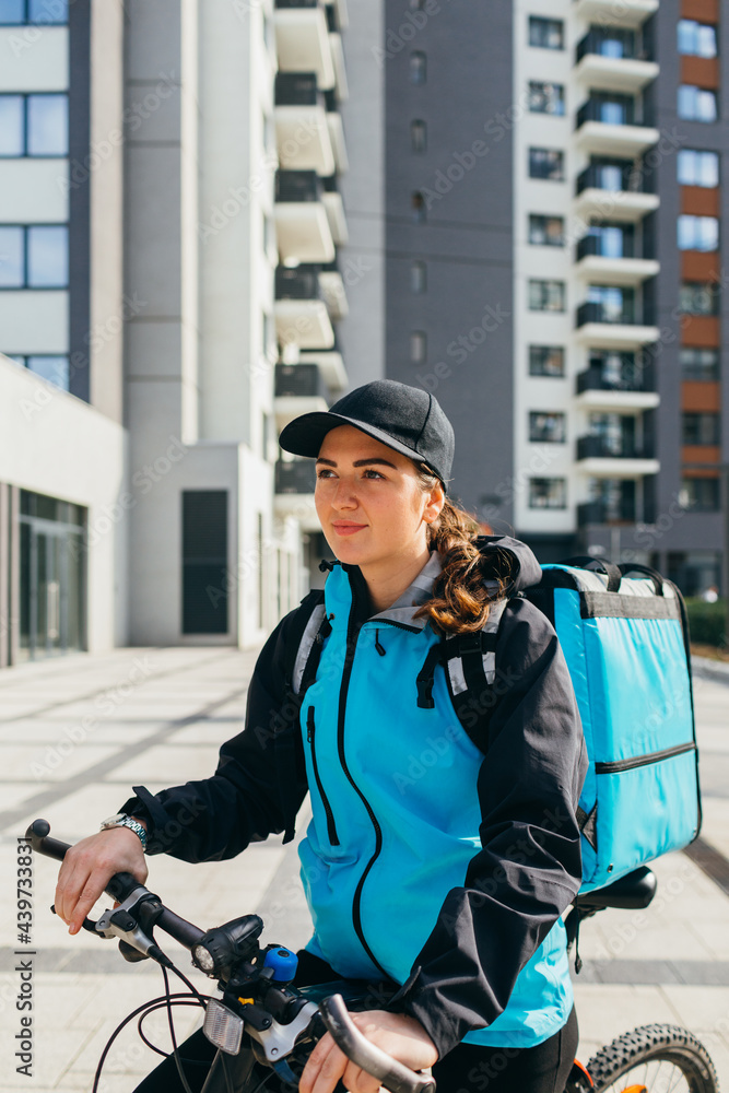 Delivery Woman Riding Bicycle Delivery Woman Riding Bicycle