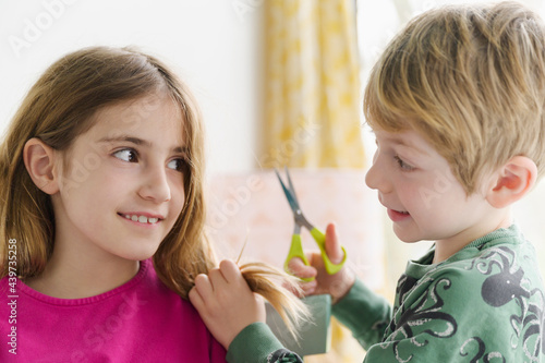 Brother About to Cut his Big Sister's Hair