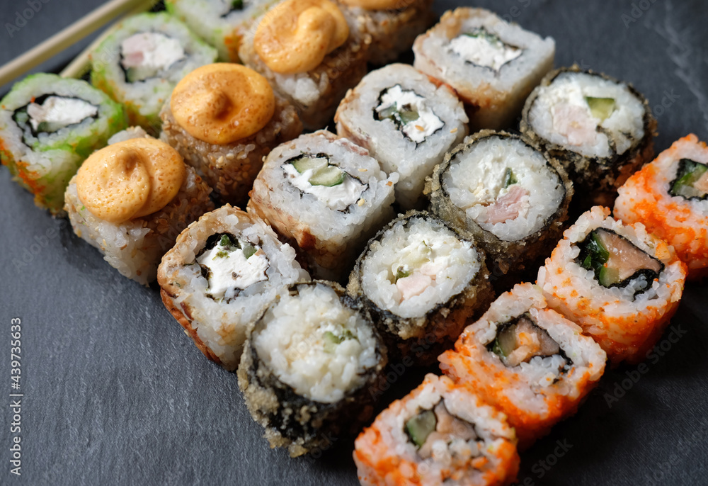 Japanese sushi food. Maki ands rolls with tuna, salmon, shrimp, crab and avocado. Japanese sushi food. Maki ands rolls with tuna, salmon, shrimp, crab and avocado.