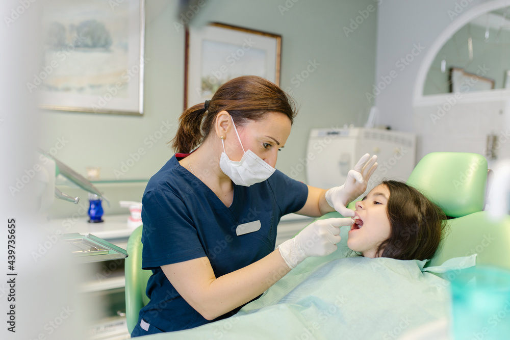 Dentist treating patient Dentist treating patient
