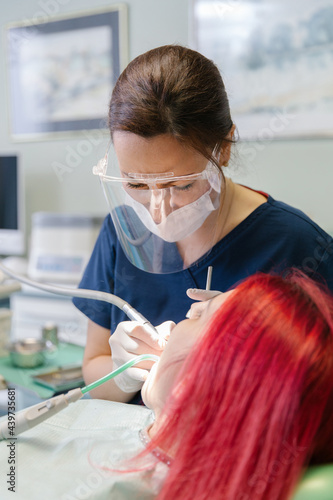 Dentist treating patient  photo