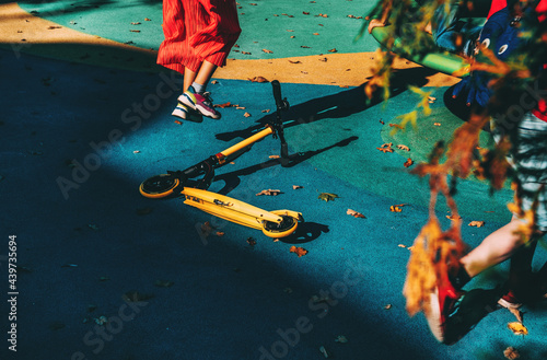 Children's playground, children run, scooter