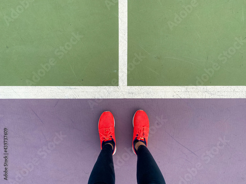 Anonymous woman on tennis court photo