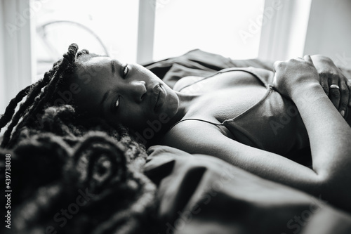Black girl lying on the bed