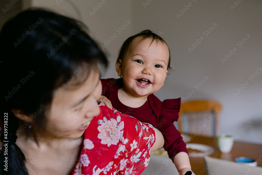 happy baby on mother's back happy baby on mother's back