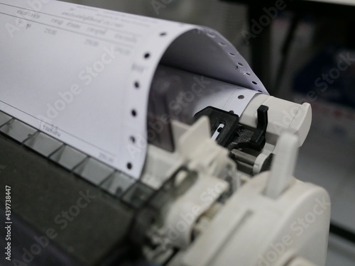 closeup of continuous paper printer in the office,selected focus.