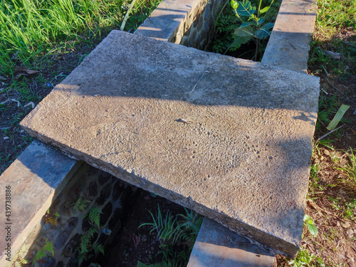 stone cross in the garden