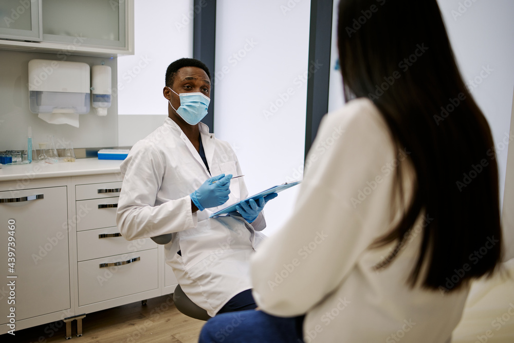 Doctor consulting client during medical appointment Doctor consulting client during medical appointment