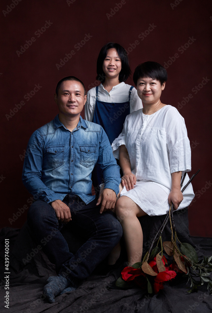 Portrait of an Asian family of three, indoors. Portrait of an Asian family of three, indoors.