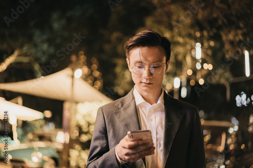 man play phone in the night photo