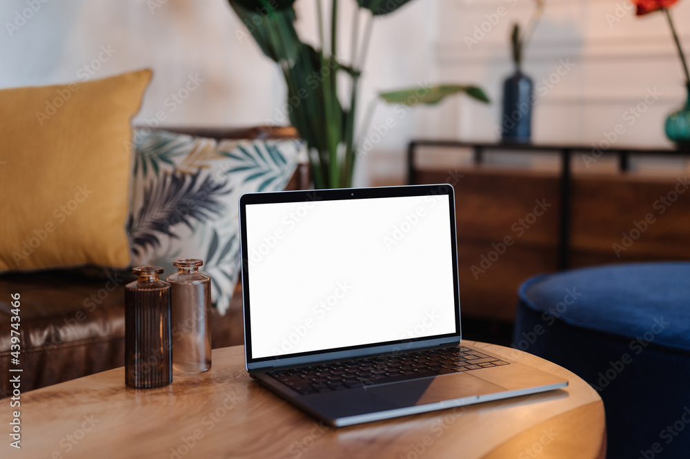 Laptop with blank screen in living room Laptop with blank screen in living room