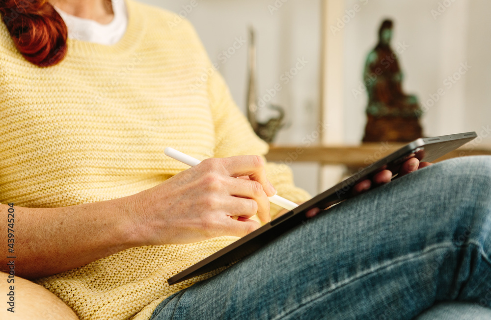 Woman drawing with tablet and stylus Woman drawing with tablet and stylus