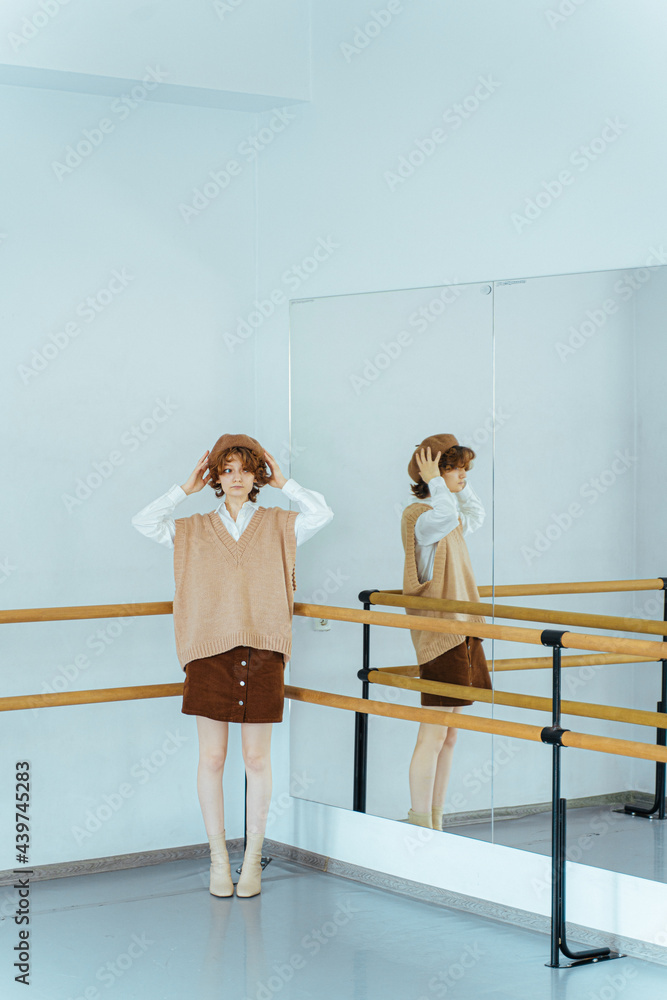 Retro woman standing in ballet studio Retro woman standing in ballet studio