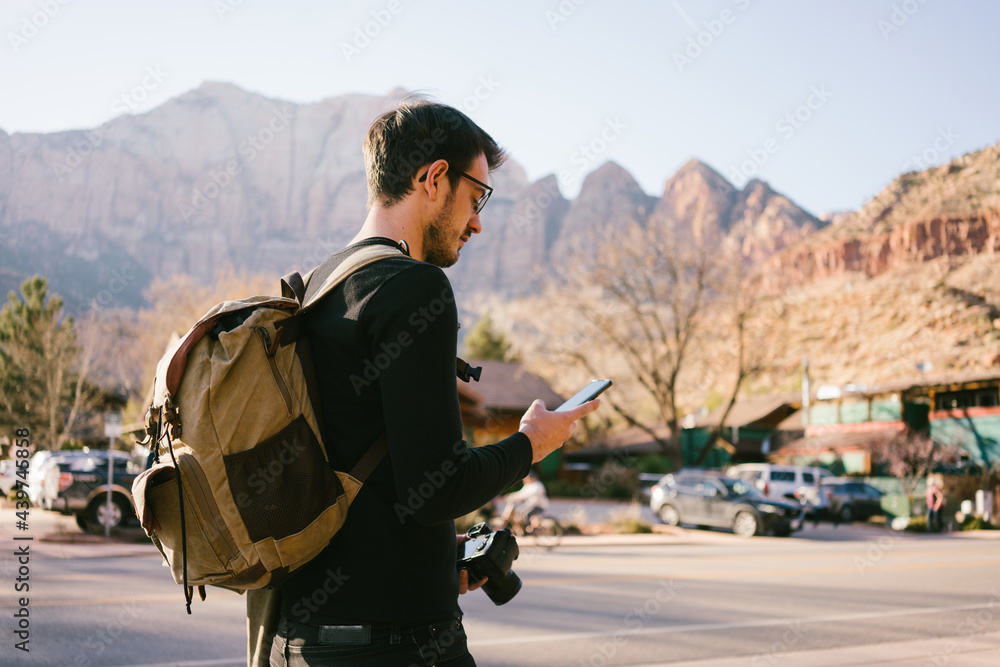 Man on Road trip Using Cell Phone Man on Road trip Using Cell Phone