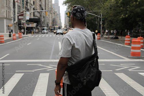 Businessman walking in Manhattan and talking on the phone. photo